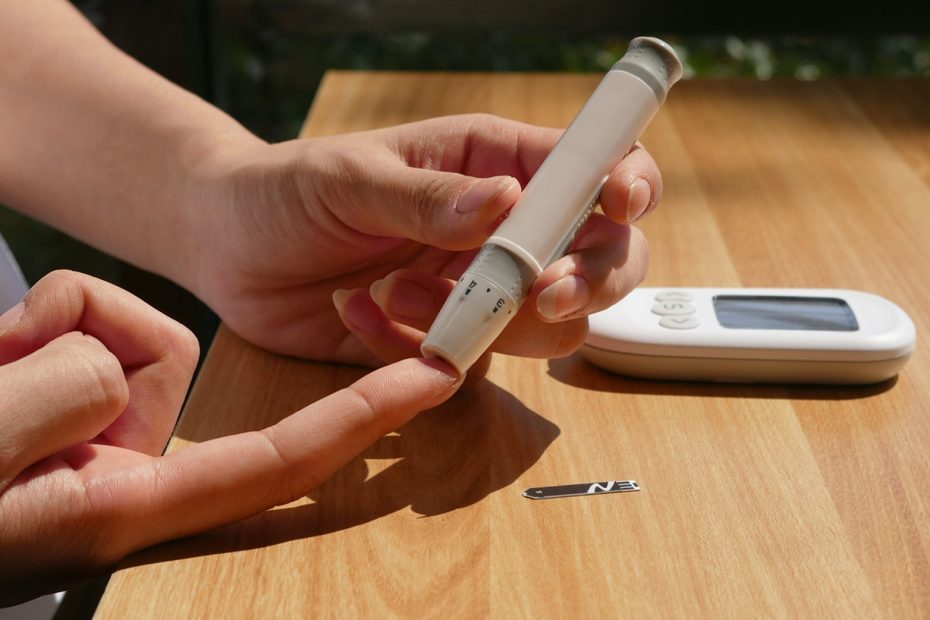 a person sitting at a table with a cell phone