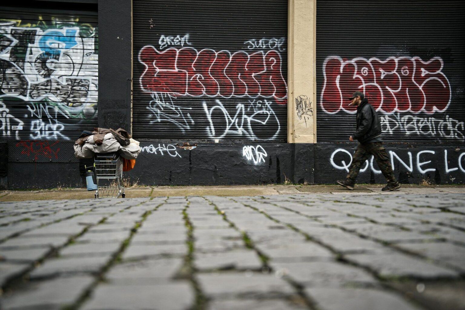 man walking on shopping cart during daytime