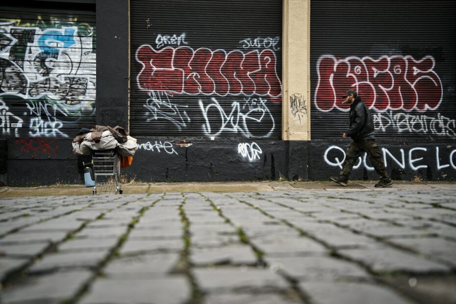 man walking on shopping cart during daytime